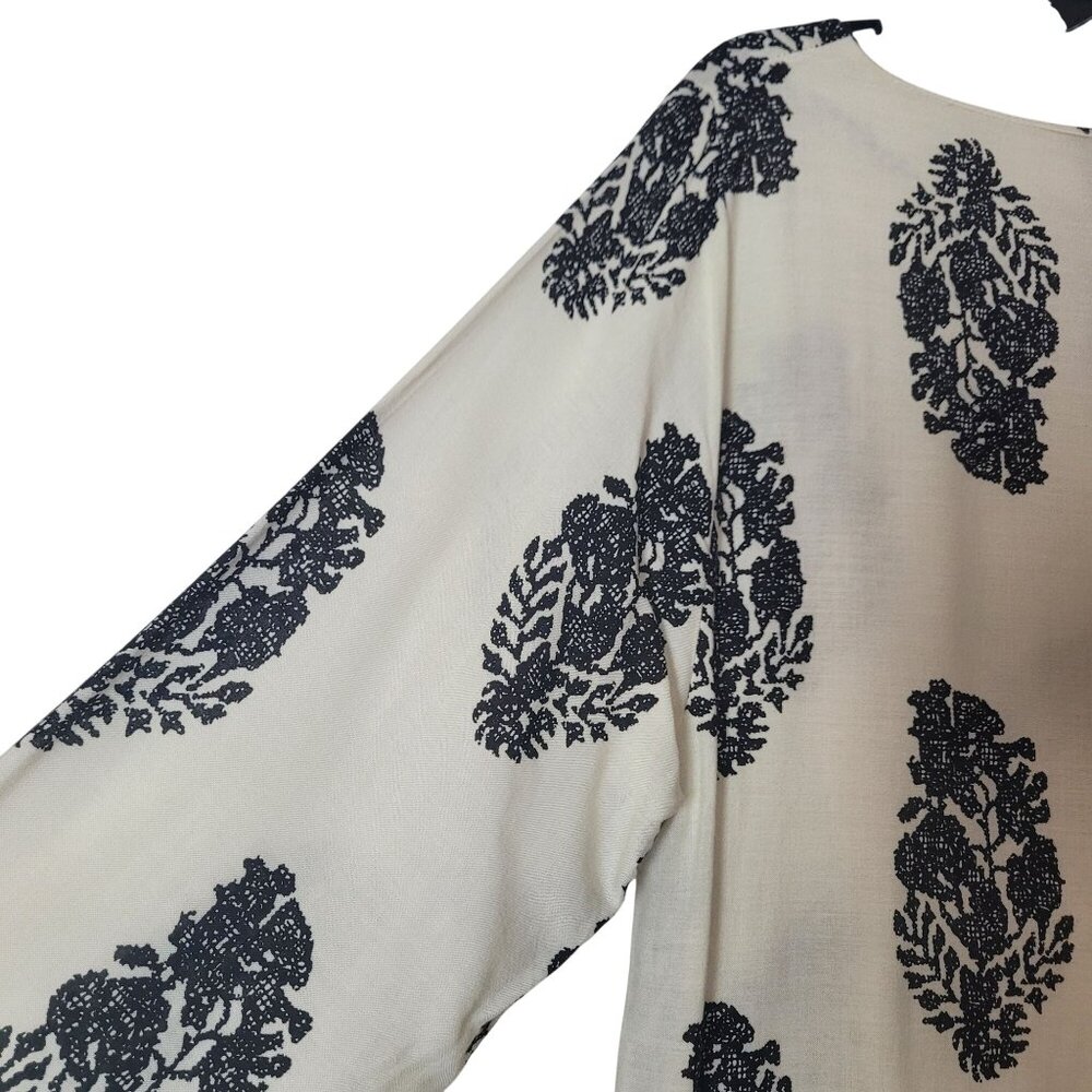 Boho-Inspired Cream & Black Tunic Dress With Tassel Tie Neckline And 3/4 Sleeves - Picture 9 of 12